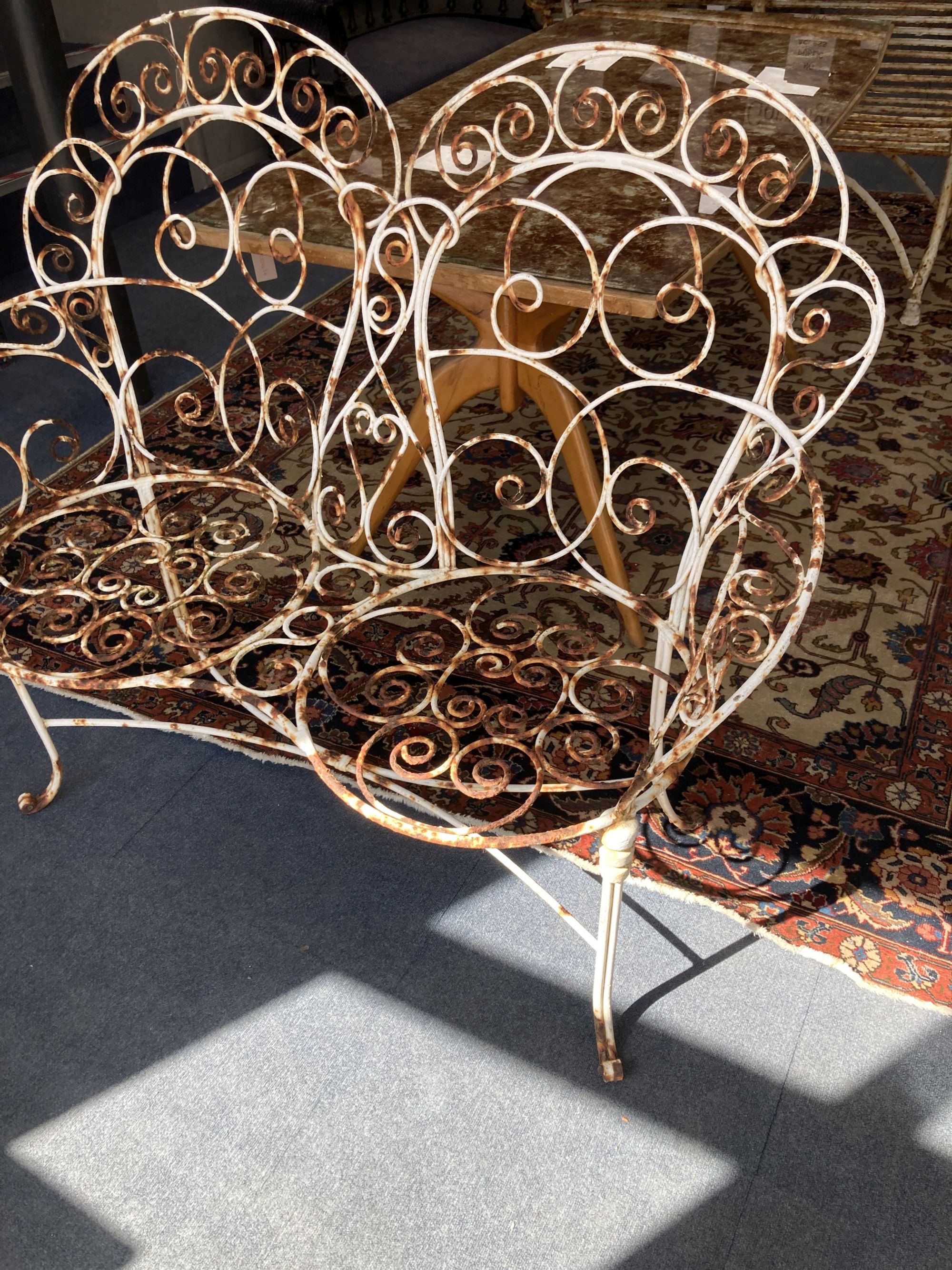 A vintage French wrought iron garden bench, length 120cm, depth 50cm, height 106cm